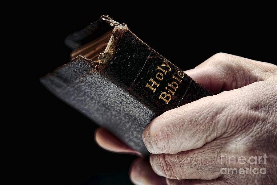 Man Hands Holding Old Bible Photograph by Olivier Le Queinec