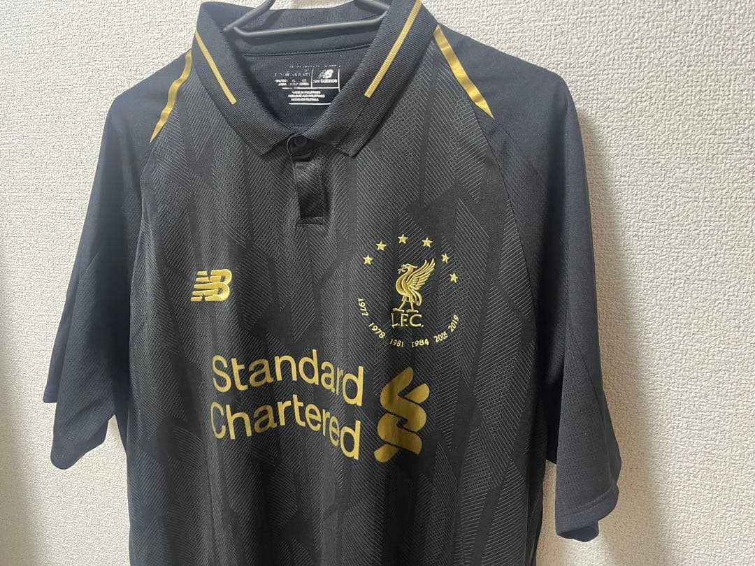 リバプールFC 18/19UCL優勝記念ユニフォーム 黒×金 L-XLサイズ - メルカリ